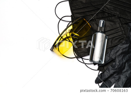 Safety equipment to fight to Coronavirus COVID-19 virus outbreak - Safety mask, hand sanitizer, latex gloves and protective glasses or goggles Safety equipment to fight to Coronavirus COVID-19 virus outbreak - Safety mask, hand sanitizer, latex gloves and protective glasses or goggles 70608163