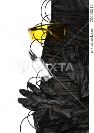 Safety equipment to fight to Coronavirus COVID-19 virus outbreak - Safety mask, hand sanitizer, latex gloves and protective glasses or goggles 70608218