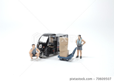 a Worker unloading boxes from truck. a Worker unloading boxes from truck. 70609507