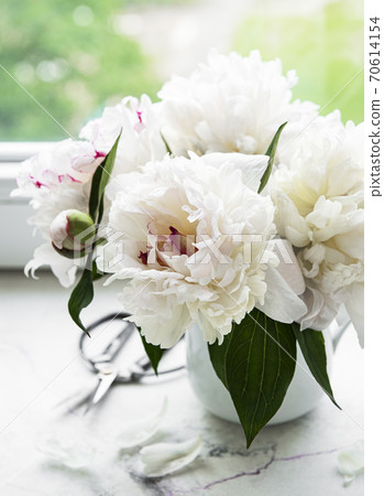 Beautiful pink peony bouquet in a vase. 70614154