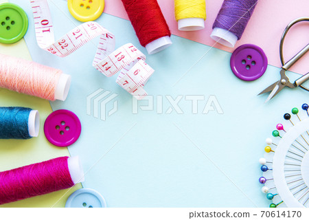 Sewing accessories on a blue pastel background 70614170