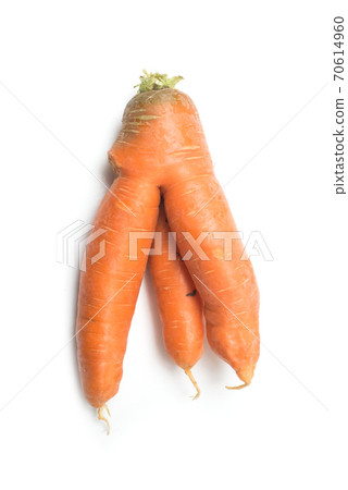 Closeup of strange carrot on white background 70614960