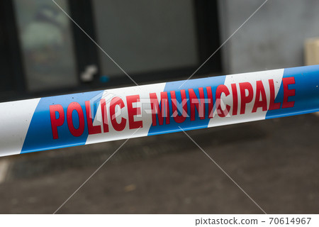 Closeup of  french municipal police security ribbon in the street 70614967