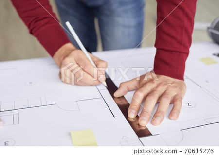 Male Architect Drawing Plans Close Up 70615276
