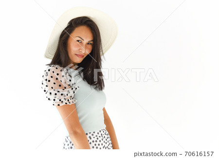 Charming ethnic woman in summer outfit Charming ethnic woman in summer outfit 70616157