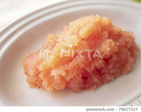 Loosened spicy cod roe on a white plate Loosened spicy cod roe on a white plate 70617327