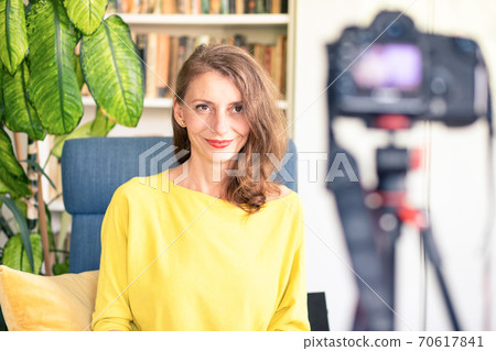teacher or vlogger recording a lesson on camera online learning 70617841