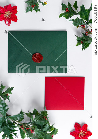 Christmas mock-up letter, envelope and holly leaves frame. 70619195