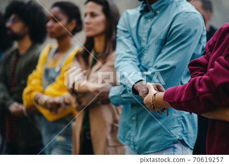 Group of people activists protesting on streets, women march and demonstration concept. Group of people activists protesting on streets, women march and demonstration concept. 70619257