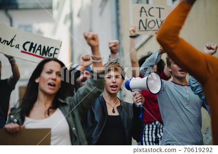Group of people activists protesting on streets, strike and demonstration concept. 70619292