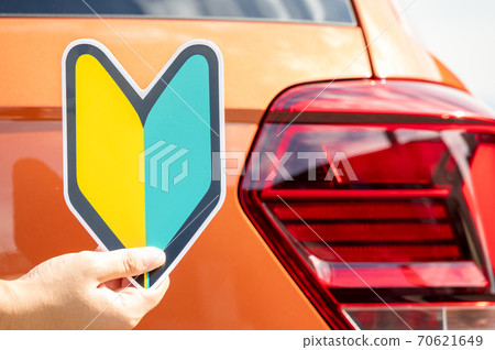 Driving a car beginner mark 70621649