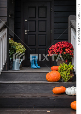 Traditional style porch, front steps decoration at Halloween, Thanksgiving season Traditional style porch, front steps decoration at Halloween, Thanksgiving season 70622285
