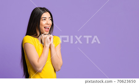 Excited Asian Female Looking At Copy Space And Exclaiming With Excitement Excited Asian Female Looking At Copy Space And Exclaiming With Excitement 70623650