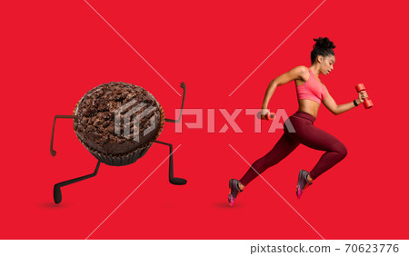Slimming African Lady Running Away From Donut Exercising, Red Background Slimming African Lady Running Away From Donut Exercising, Red Background 70623776