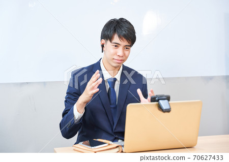 Male student undergoing a remote online interview 70627433