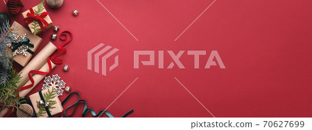 Christmas gift boxes on red background. Christmas gift boxes on red background. 70627699