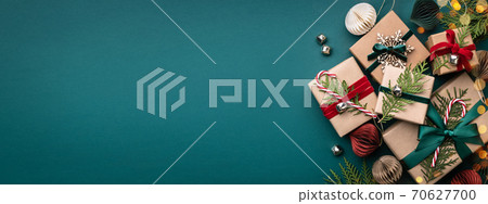 Christmas gift boxes on turquoise background. 70627700