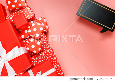 Frame of red gift boxes on pink background with copy space for text 11.11 single's day sale. Frame of red gift boxes on pink background with copy space for text 11.11 single's day sale. 70628406