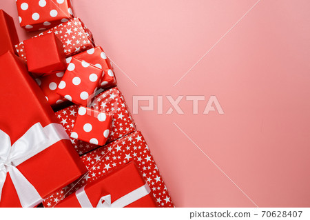 Frame of red gift boxes on pink background with copy space for text 11.11 single's day sale. Frame of red gift boxes on pink background with copy space for text 11.11 single's day sale. 70628407