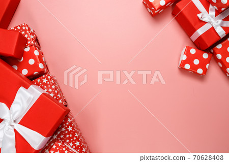 Frame of red gift boxes on pink background with copy space for text 11.11 single's day sale. Frame of red gift boxes on pink background with copy space for text 11.11 single's day sale. 70628408