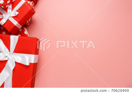 Frame of red gift boxes on pink background with copy space for text 11.11 single's day sale. Frame of red gift boxes on pink background with copy space for text 11.11 single's day sale. 70628409