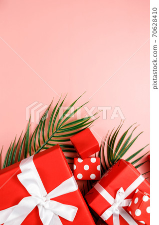 Frame of red gift boxes on pink background with copy space for text 11.11 single's day sale. Frame of red gift boxes on pink background with copy space for text 11.11 single's day sale. 70628410
