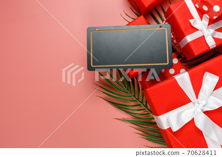 Online shopping of China, 11.11 single's day sale concept. The red gift boxes on pink background with copy space for text 11.11 single's day sale. Online shopping of China, 11.11 single's day sale concept. The red gift boxes on pink background with copy space for text 11.11 single's day sale. 70628411