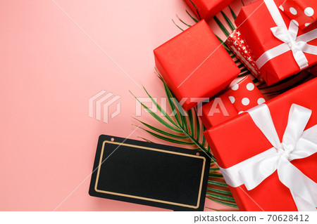 Online shopping of China, 11.11 single's day sale concept. The red gift boxes on pink background with copy space for text 11.11 single's day sale. Online shopping of China, 11.11 single's day sale concept. The red gift boxes on pink background with copy space for text 11.11 single's day sale. 70628412