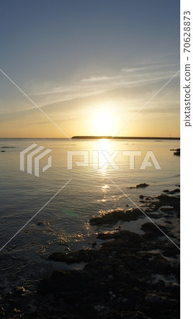 Sunset over Okinawa Kumejima Airport 70628873