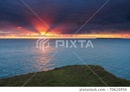Amazing orange sunset, St. Anns Head with Skokholm island, Pembrokeshire, Wales 70628956