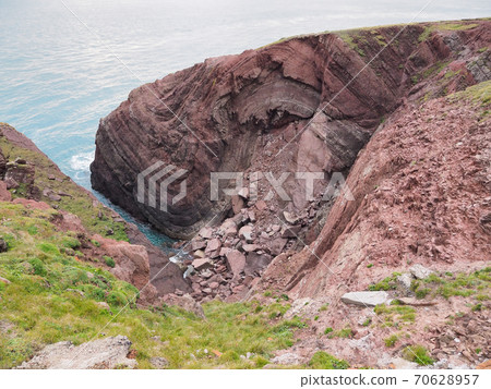 Cobblers Hole, St Anns Head, folds in the Sandstone rock, Pembrokeshire, Wales 70628957