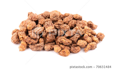 Tigernuts isolated on white background. Pile of chufa nuts or tiger nuts. Tigernuts isolated on white background. Pile of chufa nuts or tiger nuts. 70631484