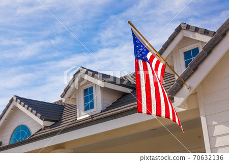 American Flag Hanging From House Facade American Flag Hanging From House Facade 70632136