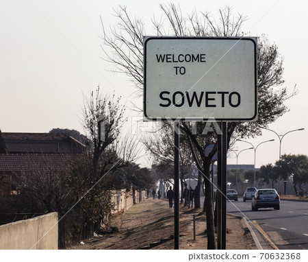 Welcome to Soweto is  roadside welcome banner inviting you to visit the Soweto area of Johannesburg. 70632368