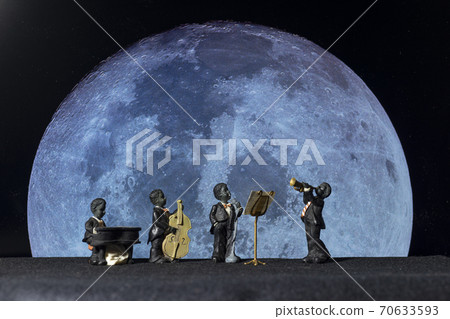 Orchestral doll taken against the background of a moon photograph Orchestral doll taken against the background of a moon photograph 70633593