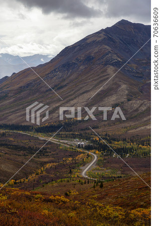 View of Scenic Road from Above surrounded by Trees and Mountains 70636609