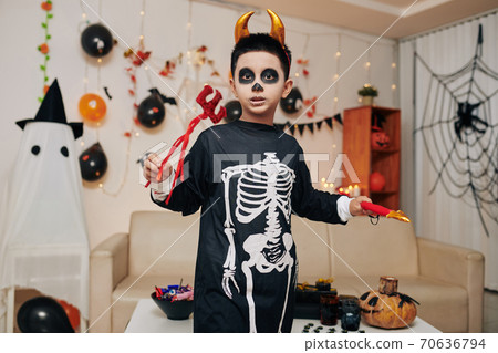 Boy dressed as devil Boy dressed as devil 70636794