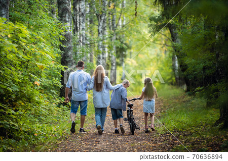 Happy family outdoor portrait in a forest 70636894