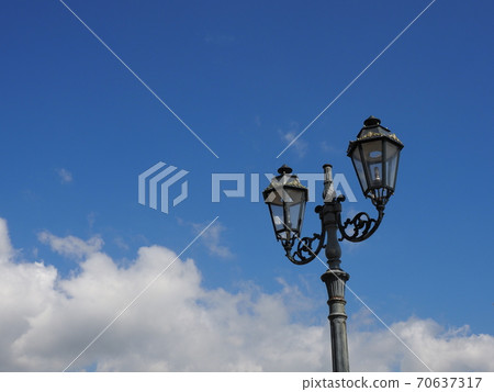 Retro streetlights against the blue sky 70637317