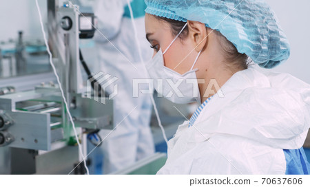 Face mask production line in modern factory Face mask production line in modern factory 70637606