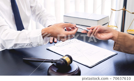 Lawyer or judge present client with contract document papers, Law and Legal services concept Lawyer or judge present client with contract document papers, Law and Legal services concept 70637610