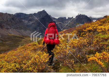 Woman Backpacking on Scenic Rocky Hiking Trail 70637768