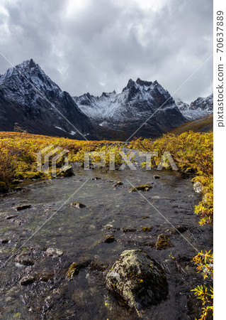 Scenic Alpine River and Mountains on Fall Day 70637889