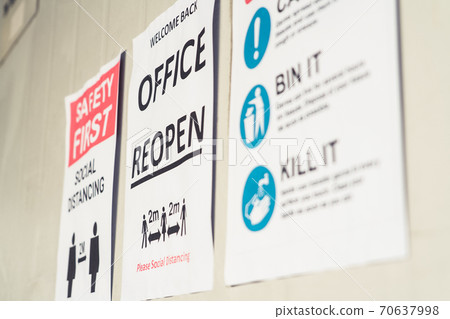 Sign caution in factory warning to industry labor worker to prevent Covid-19 70637998