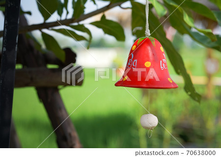 red ceramic bells hanging on a string red ceramic bells hanging on a string 70638000