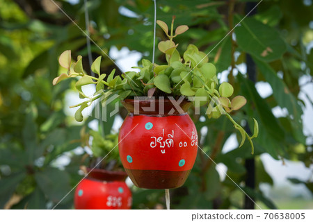 red ceramic bells hanging on a string red ceramic bells hanging on a string 70638005