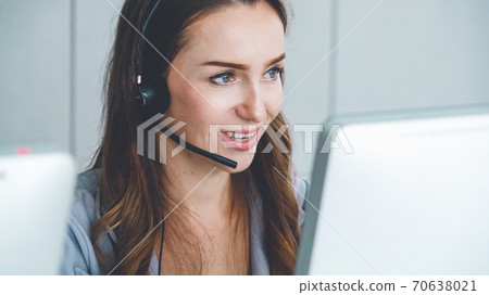 Business people wearing headset working in office 70638021