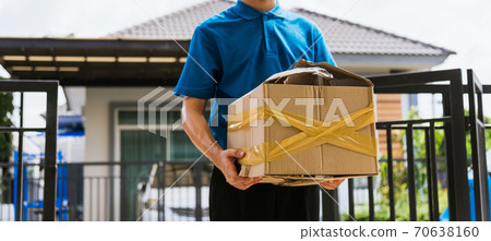 Delivery man he emotional courier hold damaged cardboard box is broken 70638160