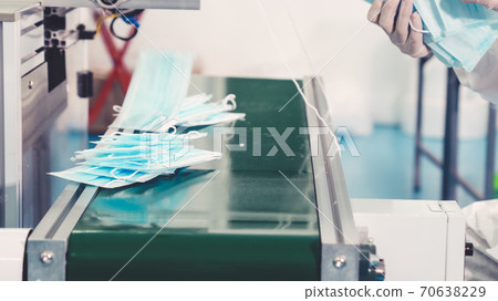 Face mask production line in modern factory Face mask production line in modern factory 70638229
