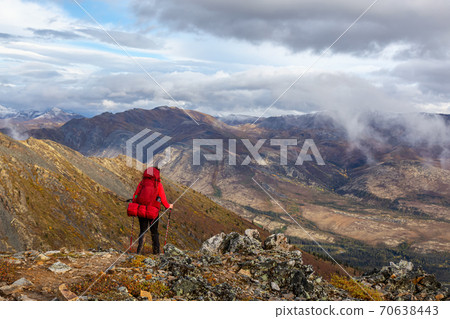 Woman Backpacking in Scenic Mountain Landscape 70638443